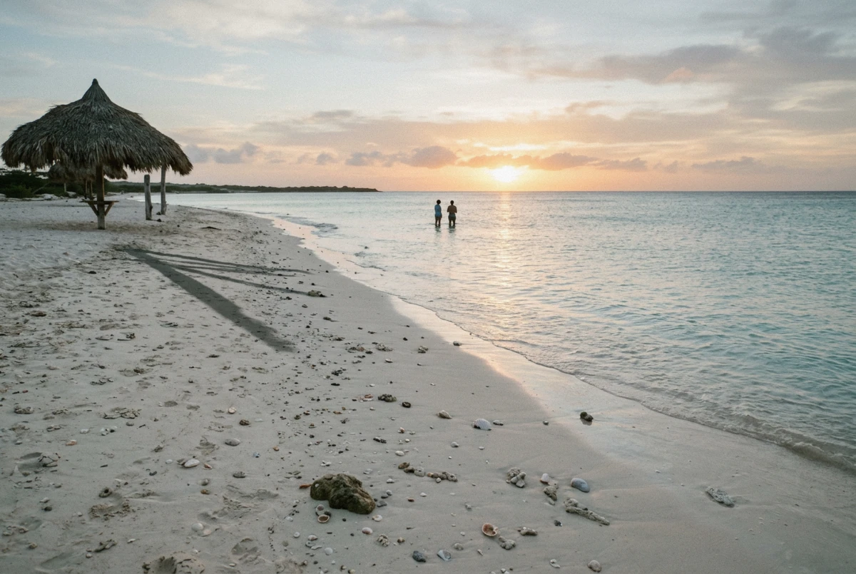 Calm shallow water and pale sand at Arashi Beach in late afternoon light on an Aruba photoshoot, Aruba